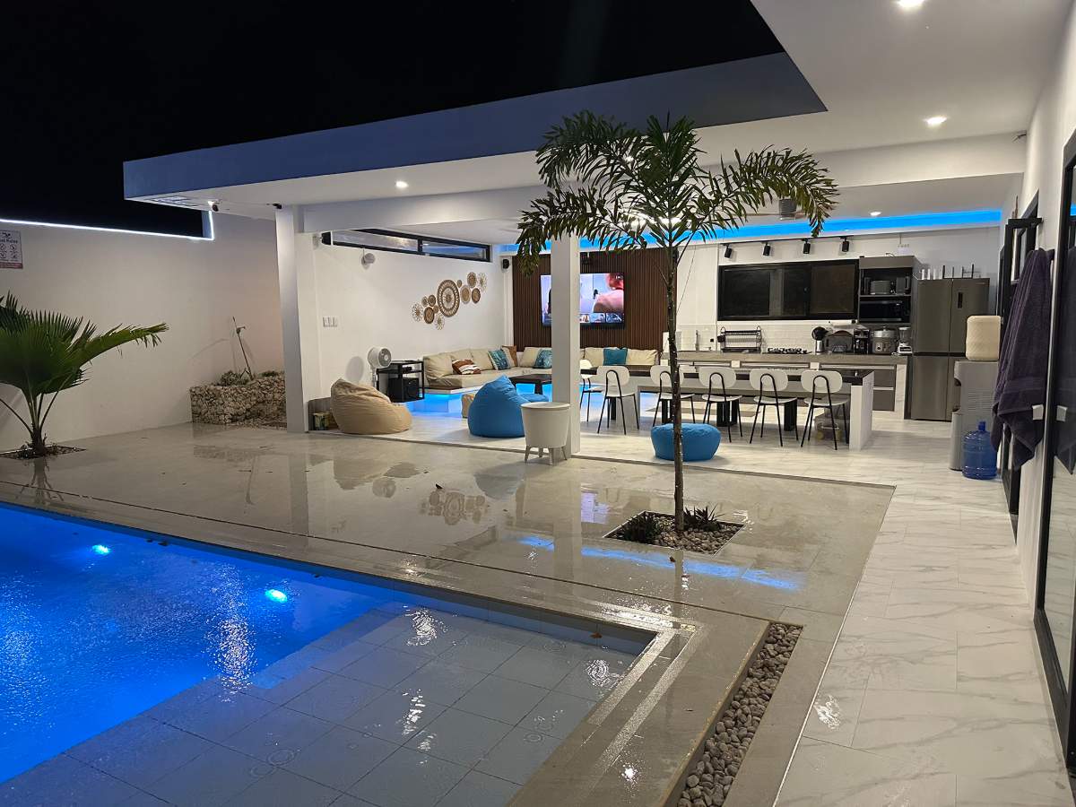 La Celeste beach house at night with pool